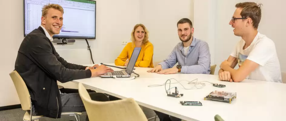 Professionally looking students in a meeting room
