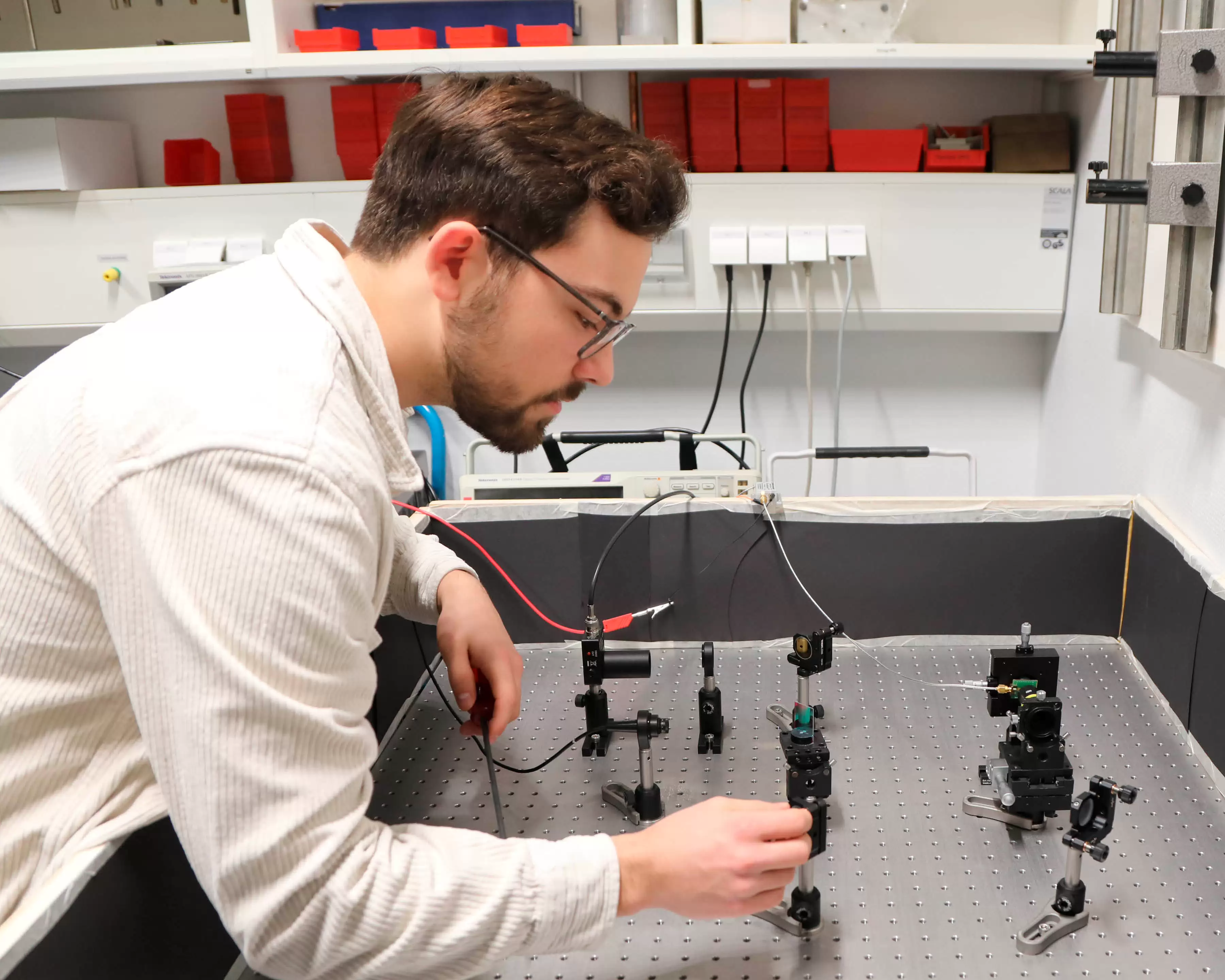 Student working on a quantum setup.