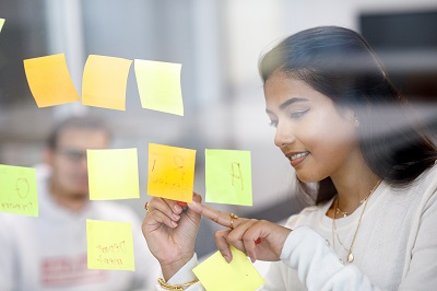 Image showing a student working with post it notes