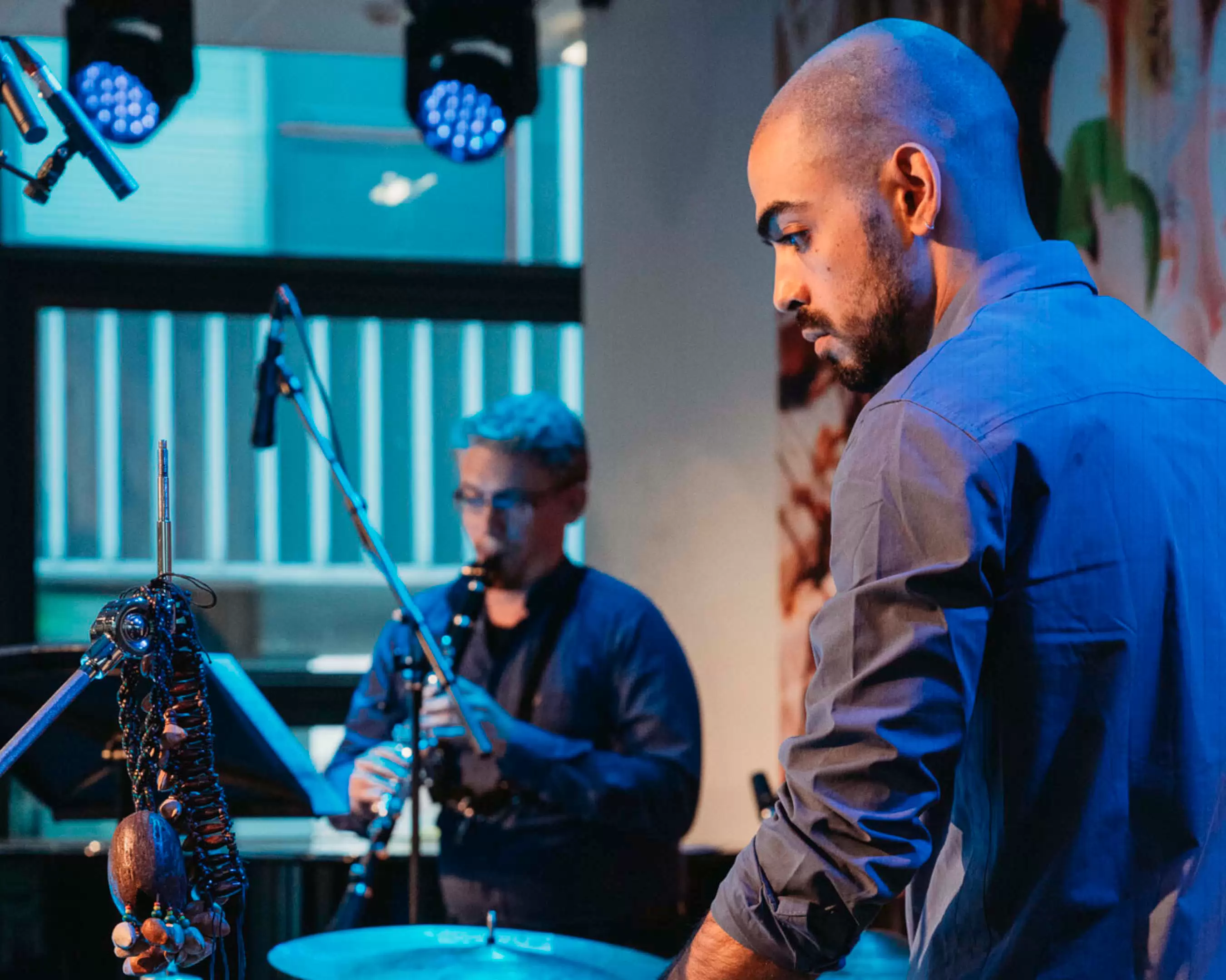 a student from the bachelor programme Fontys Conservatory of Music is practicing at school with drums and clarinet
