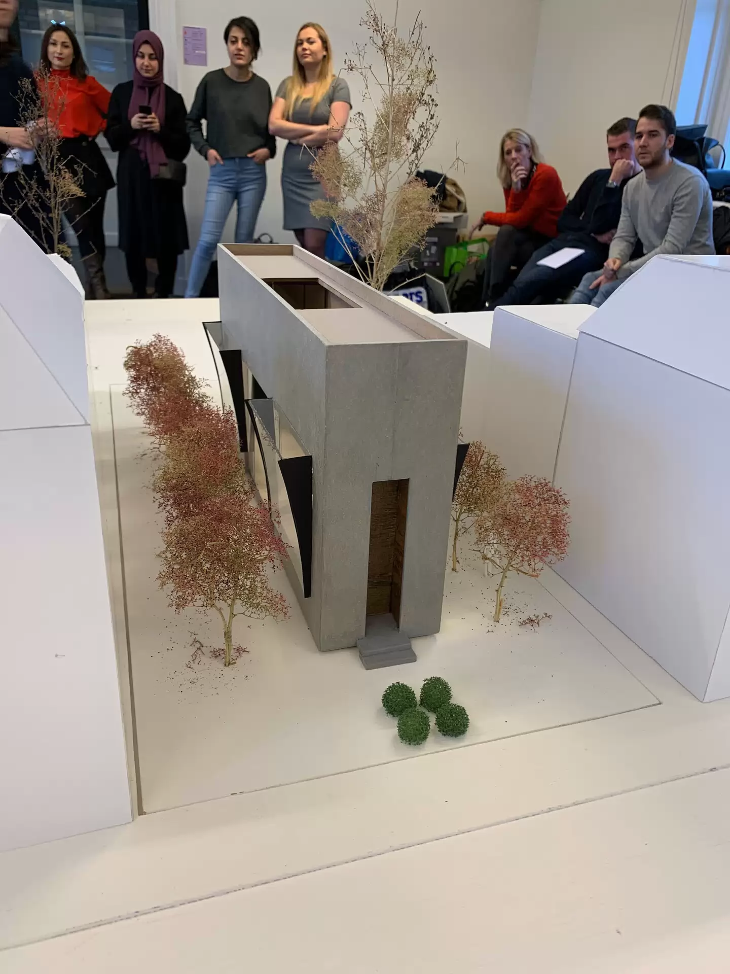 students are listening to eachother during a presentation