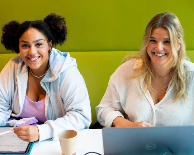 Students working behind a laptop 