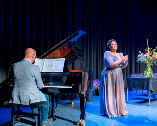 A vocalist student from the Master of Music is performing on stage together with a pianist