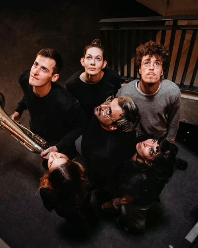 group of students MAster of Music looking up for a photoshoot for a cover album
